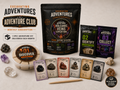 Adventure Club monthly subscription with one Excavating Adventures kit, excavation dig, discovery cards, Gemling mystery pack, specimen cards, rocks, and dig tool.