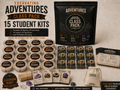 Excavating Adventures Class Pack product image showing 15 round dig kits, 15 card sets, 15 classroom inserts, dig sticks, a large class pack pouch, teacher guide, and Pebble Gemling bag for classroom science adventures.